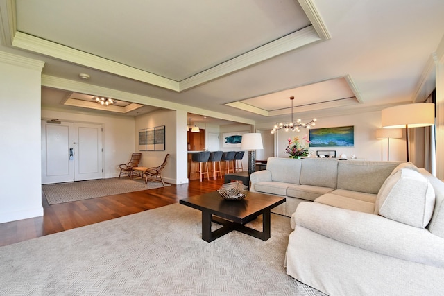 1 Ritz Carlton Dr Unit 1626, Lahaina, HI 96761 - living area with a raised ceiling, ornamental molding, a chandelier, wood finished floors, and carpet