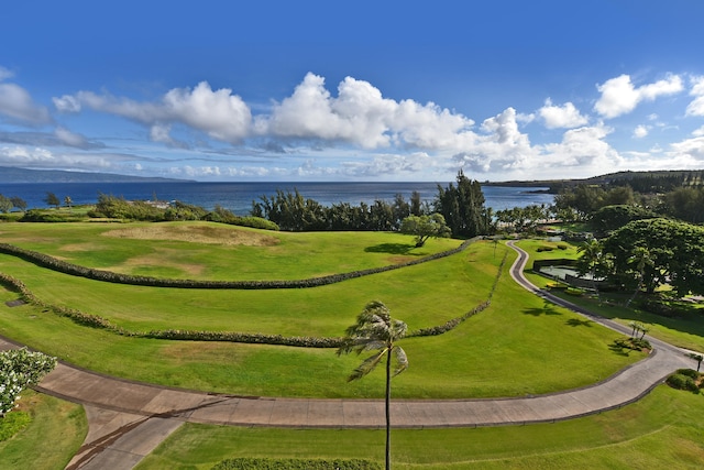 view of home's community featuring a water view and a yard