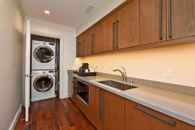1 Ritz Carlton Dr Unit 1626, Lahaina, HI 96761 - washroom with stacked washing machine and dryer, crown molding, dark wood-style floors, and recessed lighting