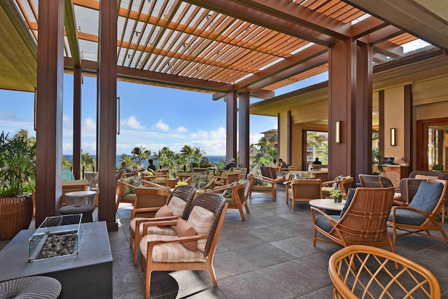 1 Ritz Carlton Dr Unit 1626, Lahaina, HI 96761 - view of patio featuring an outdoor living space with a fire pit, a pergola, and outdoor dining area