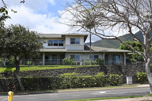 view of front of home featuring a mountain view