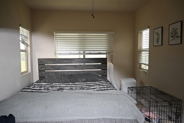 bedroom featuring multiple windows