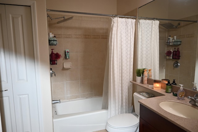 bathroom featuring toilet, shower / bath combination with curtain, and vanity