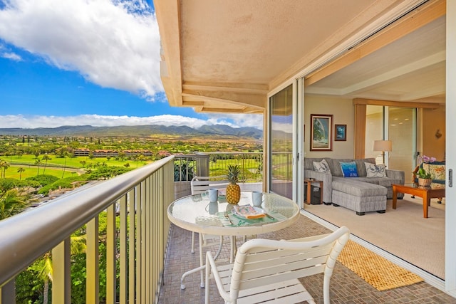 balcony featuring a mountain view