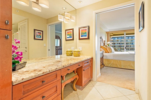 bathroom featuring tile patterned flooring and vanity