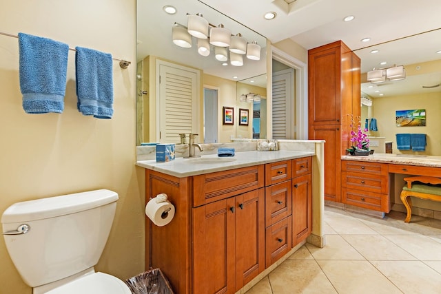 bathroom featuring tile patterned flooring, vanity, and toilet