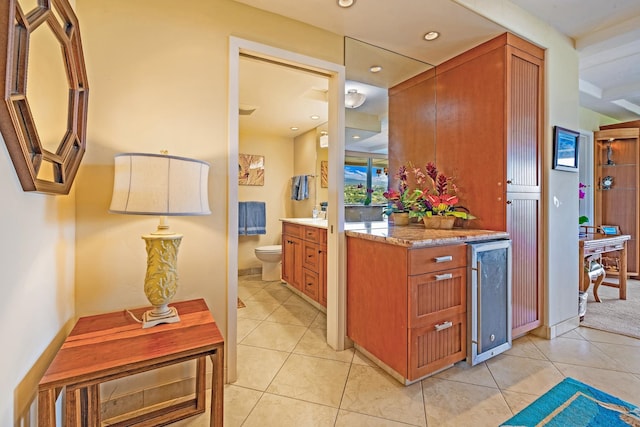 interior space with beverage cooler and light tile patterned floors