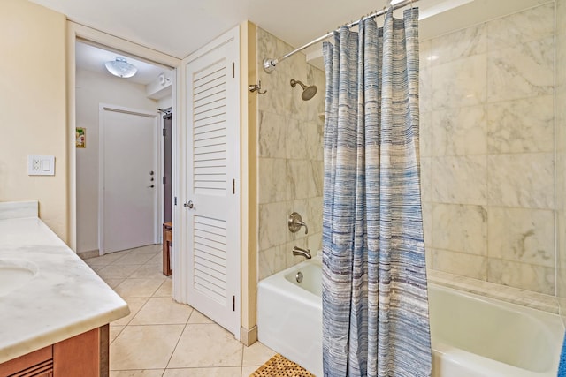 bathroom featuring tile patterned flooring, vanity, and shower / bathtub combination with curtain