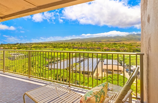 balcony featuring a mountain view