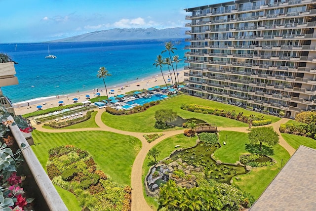 aerial view featuring a beach view and a water and mountain view