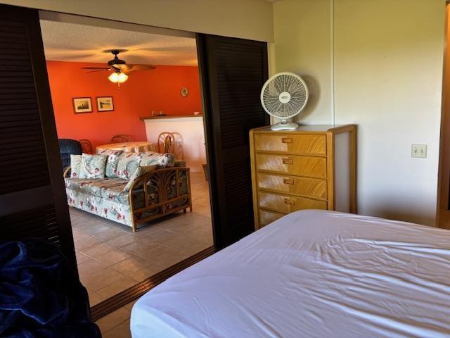 50 Kepuhi Pl Unit 159, Maunaloa, HI 96770 - bedroom with tile patterned flooring and ceiling fan