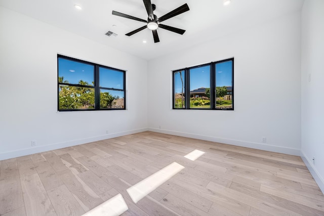 spare room with light hardwood / wood-style flooring and ceiling fan