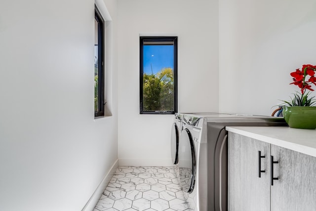 washroom featuring washer and clothes dryer