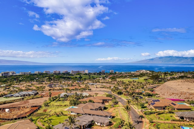 drone / aerial view with a water and mountain view