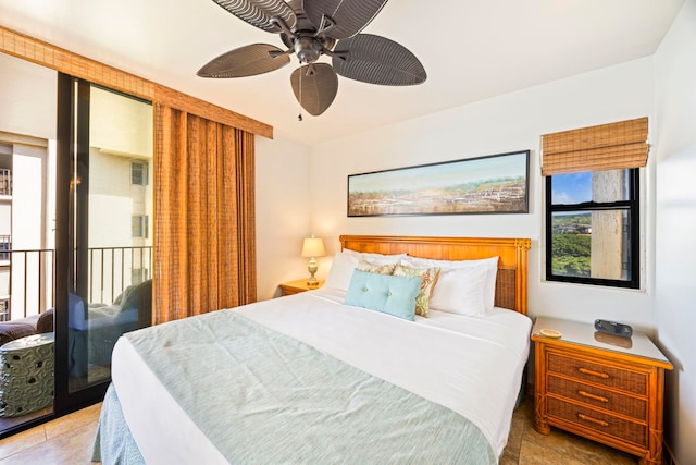 tiled bedroom featuring ceiling fan