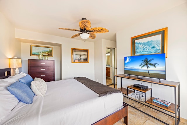 bedroom with ensuite bathroom and ceiling fan