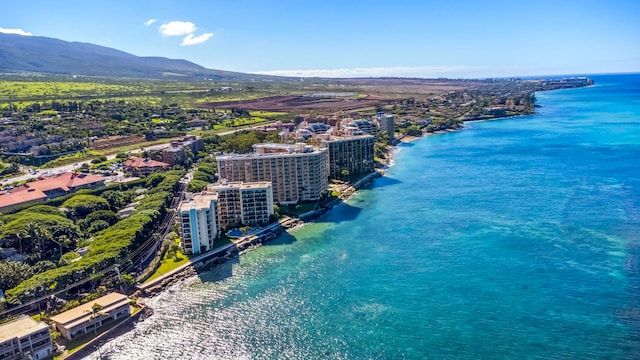 bird's eye view with a water and mountain view