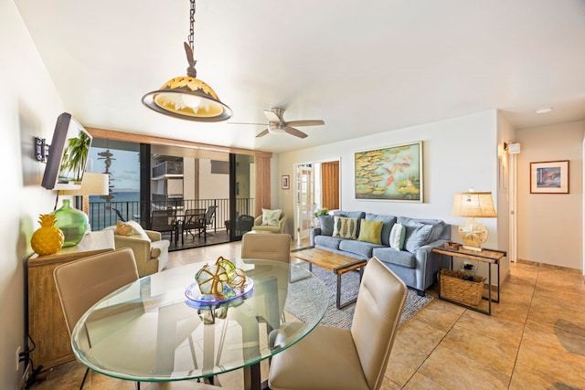 tiled dining room with a wealth of natural light and ceiling fan