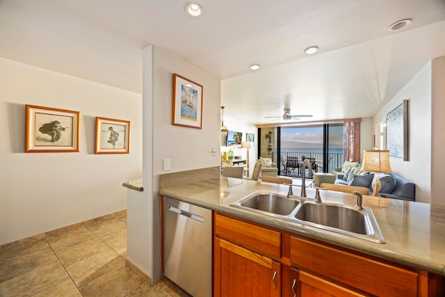 kitchen featuring ceiling fan, sink, light tile patterned floors, and stainless steel dishwasher