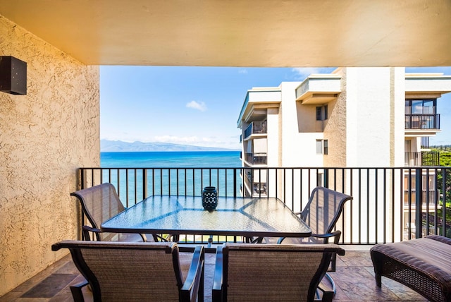 balcony with a water and mountain view