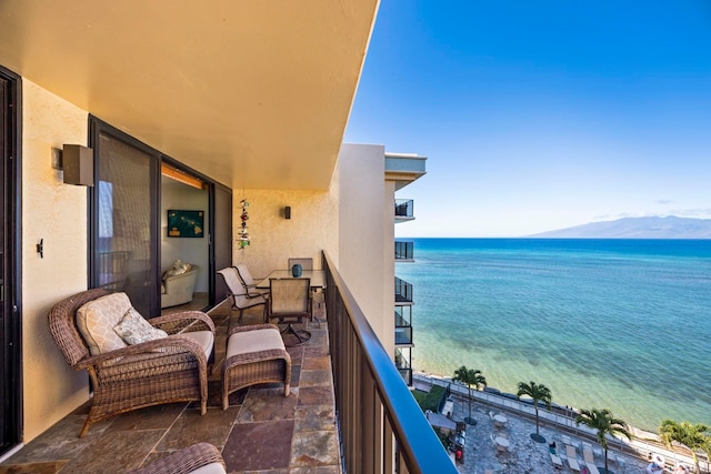 balcony with a water and mountain view