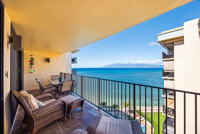 balcony with a water and mountain view