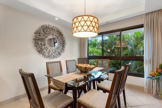 dining space featuring light tile patterned flooring