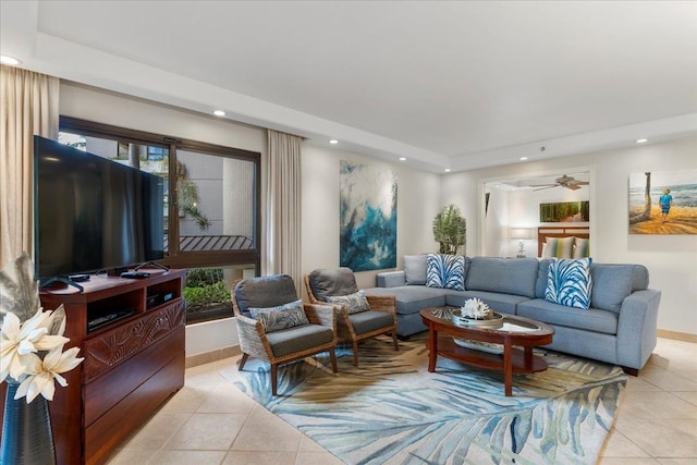 tiled living room featuring ceiling fan