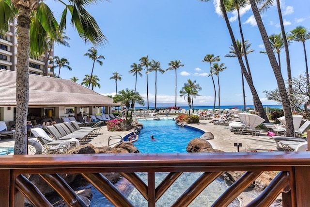 view of swimming pool with a water view