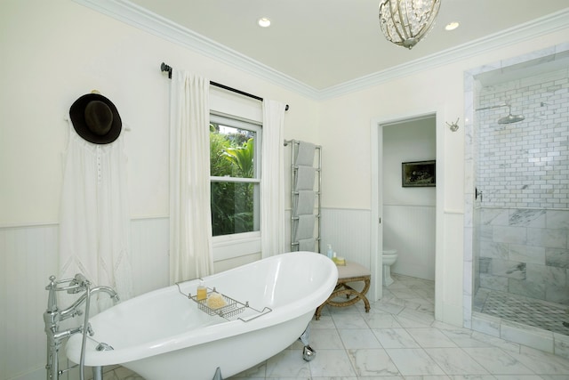 bathroom featuring separate shower and tub, toilet, and ornamental molding