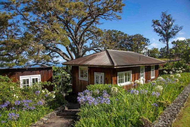 view of side of home featuring french doors