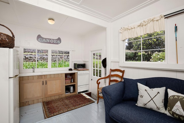 interior space with hardwood / wood-style floors and white refrigerator