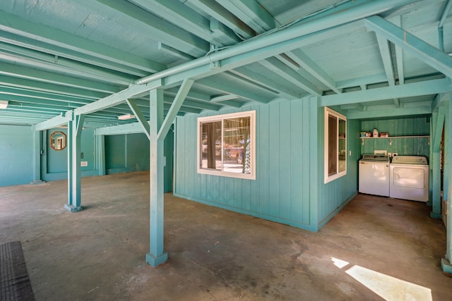 view of home's exterior featuring a patio area, washing machine and clothes dryer, and an outdoor kitchen