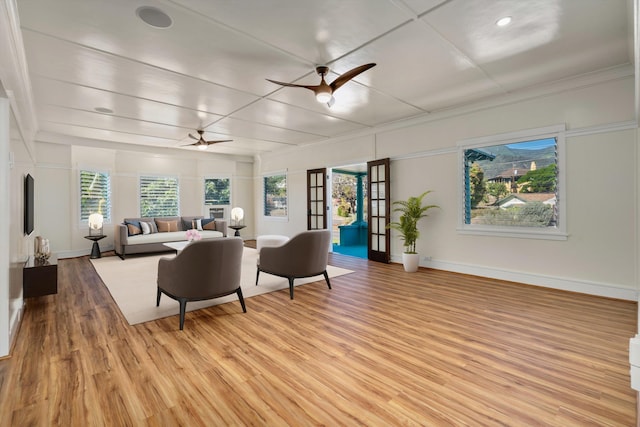 living room featuring ceiling fan and light wood-type flooring