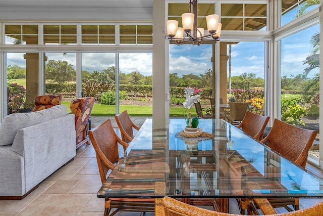 dining area with a healthy amount of sunlight and a notable chandelier