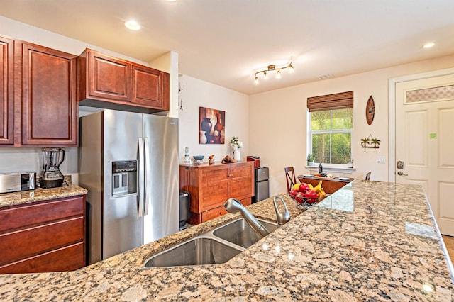 24 One Hali Ln Unit 7-203, Kihei, HI 96753 - kitchen with stainless steel fridge with ice dispenser, a sink, light stone counters, and recessed lighting