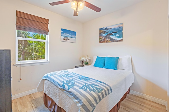 24 One Hali Ln Unit 7-203, Kihei, HI 96753 - bedroom featuring wood finished floors, baseboards, and ceiling fan