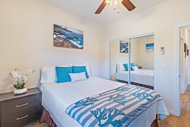 24 One Hali Ln Unit 7-203, Kihei, HI 96753 - bedroom featuring light wood-style flooring, a closet, baseboards, and a ceiling fan