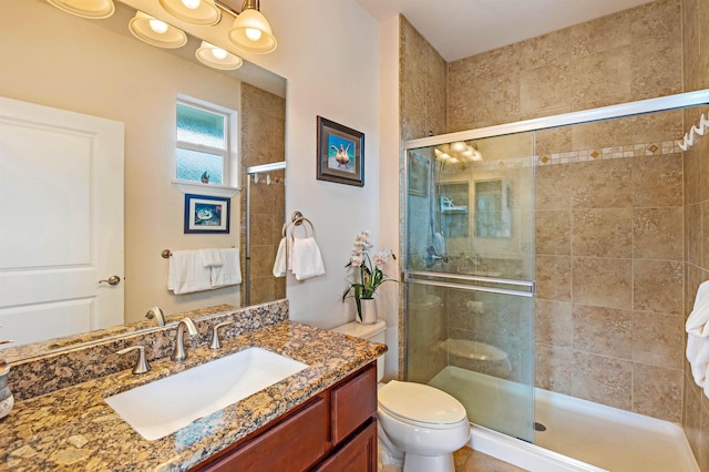 24 One Hali Ln Unit 7-203, Kihei, HI 96753 - full bath featuring a stall shower, vanity, and toilet