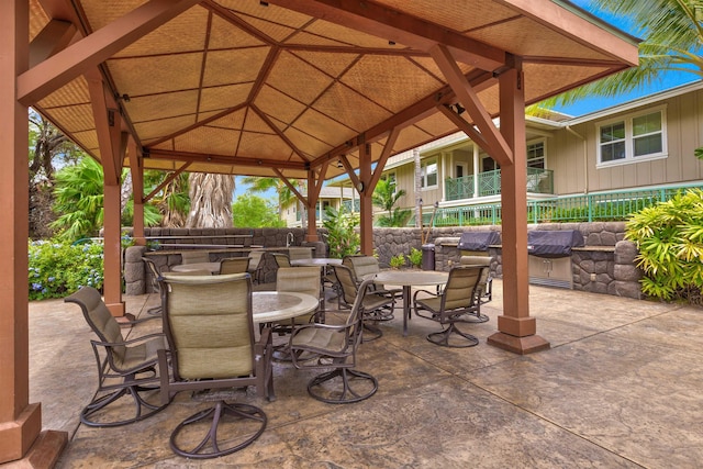 24 One Hali Ln Unit 7-203, Kihei, HI 96753 - view of patio / terrace featuring outdoor dining area, a gazebo, and an outdoor kitchen