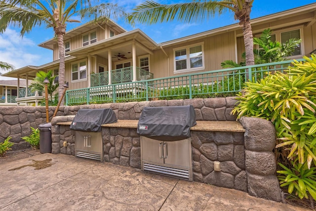 24 One Hali Ln Unit 7-203, Kihei, HI 96753 - view of front of property featuring an outdoor kitchen, ceiling fan, and a patio