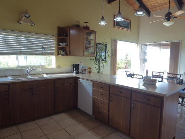 kitchen with pendant lighting, wood ceiling, beam ceiling, white dishwasher, and kitchen peninsula