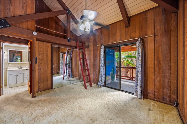 interior space featuring high vaulted ceiling, wooden walls, ceiling fan, beamed ceiling, and wood ceiling