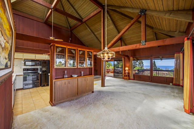 interior space with wooden ceiling, high vaulted ceiling, pendant lighting, light carpet, and black appliances