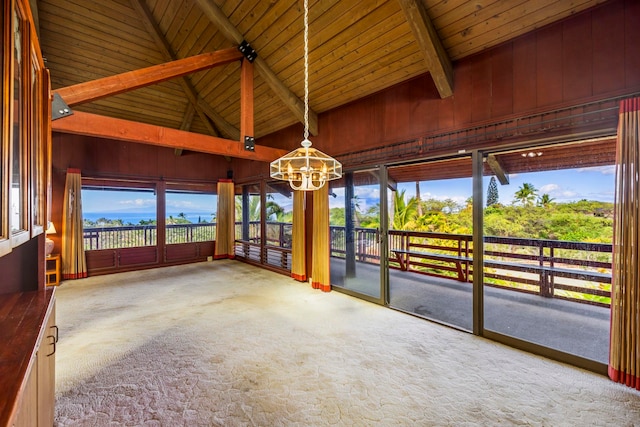 interior space with vaulted ceiling with beams and wooden ceiling