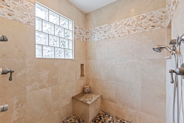 bathroom with tiled shower