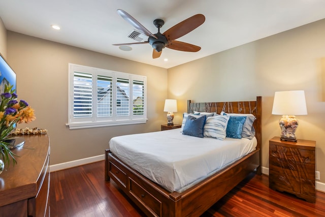 bedroom with dark wood-type flooring and ceiling fan