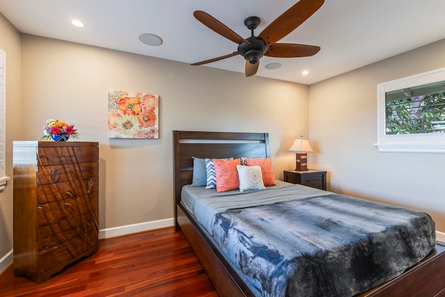 bedroom featuring dark hardwood / wood-style flooring and ceiling fan