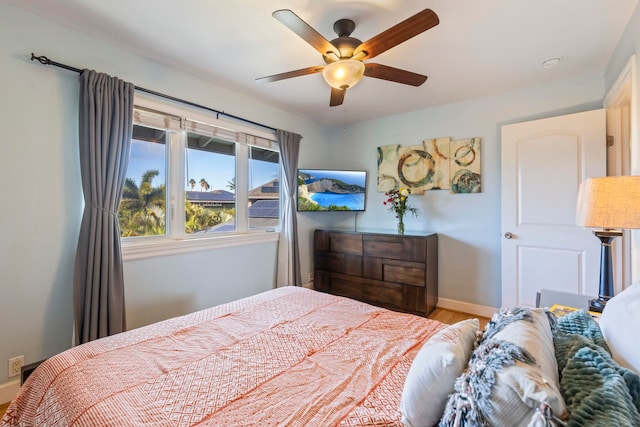 bedroom featuring hardwood / wood-style floors and ceiling fan