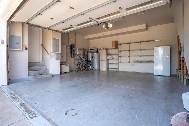 garage featuring electric panel, a garage door opener, gas water heater, and white refrigerator